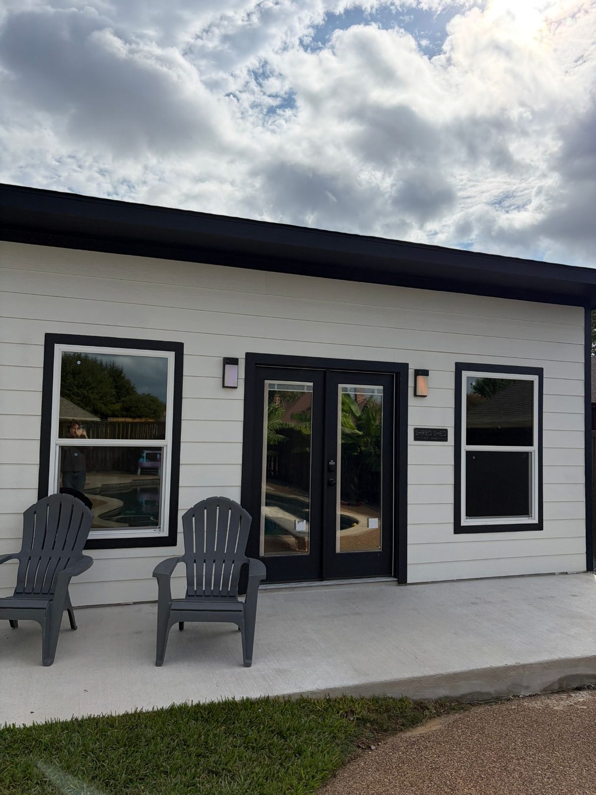 Backyard home gym with solar window film on the windows and French doors