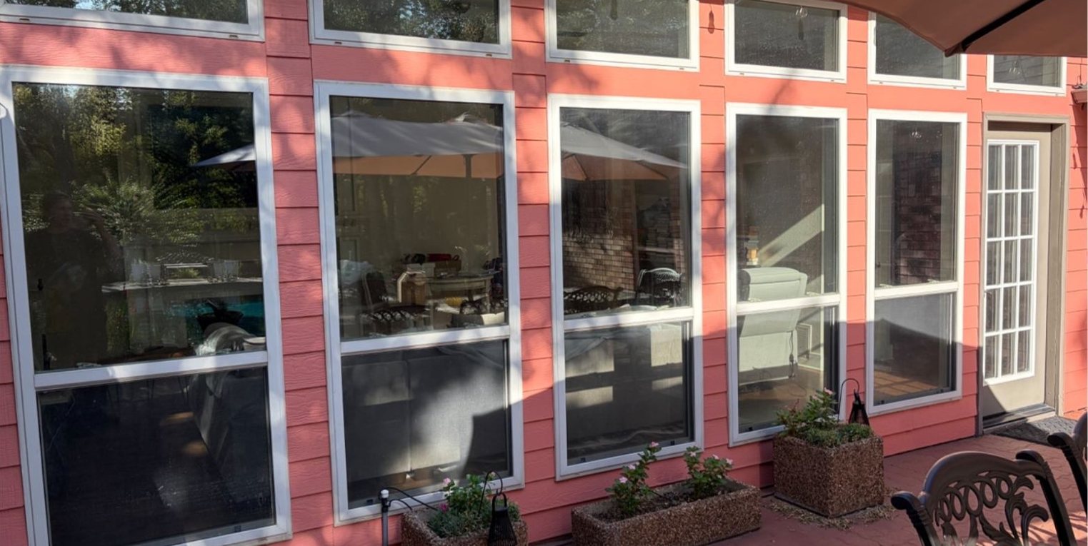 Same patio windows before tint, living room visible from outside