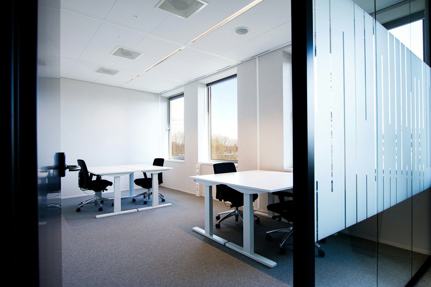 Office glass wall with striped frosted film